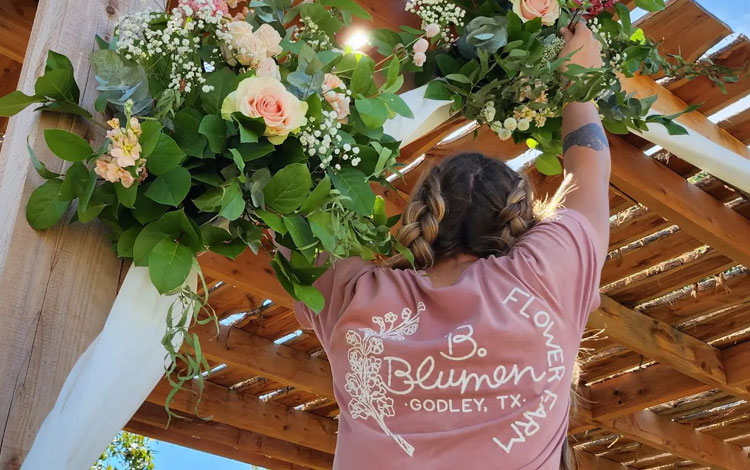 Woman standing and decorating for wedding.